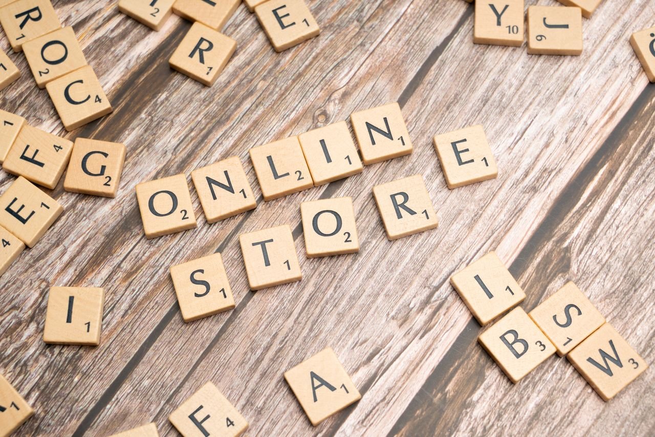 Services Scrabble tiles spelling 'online store' on a rustic wooden background.